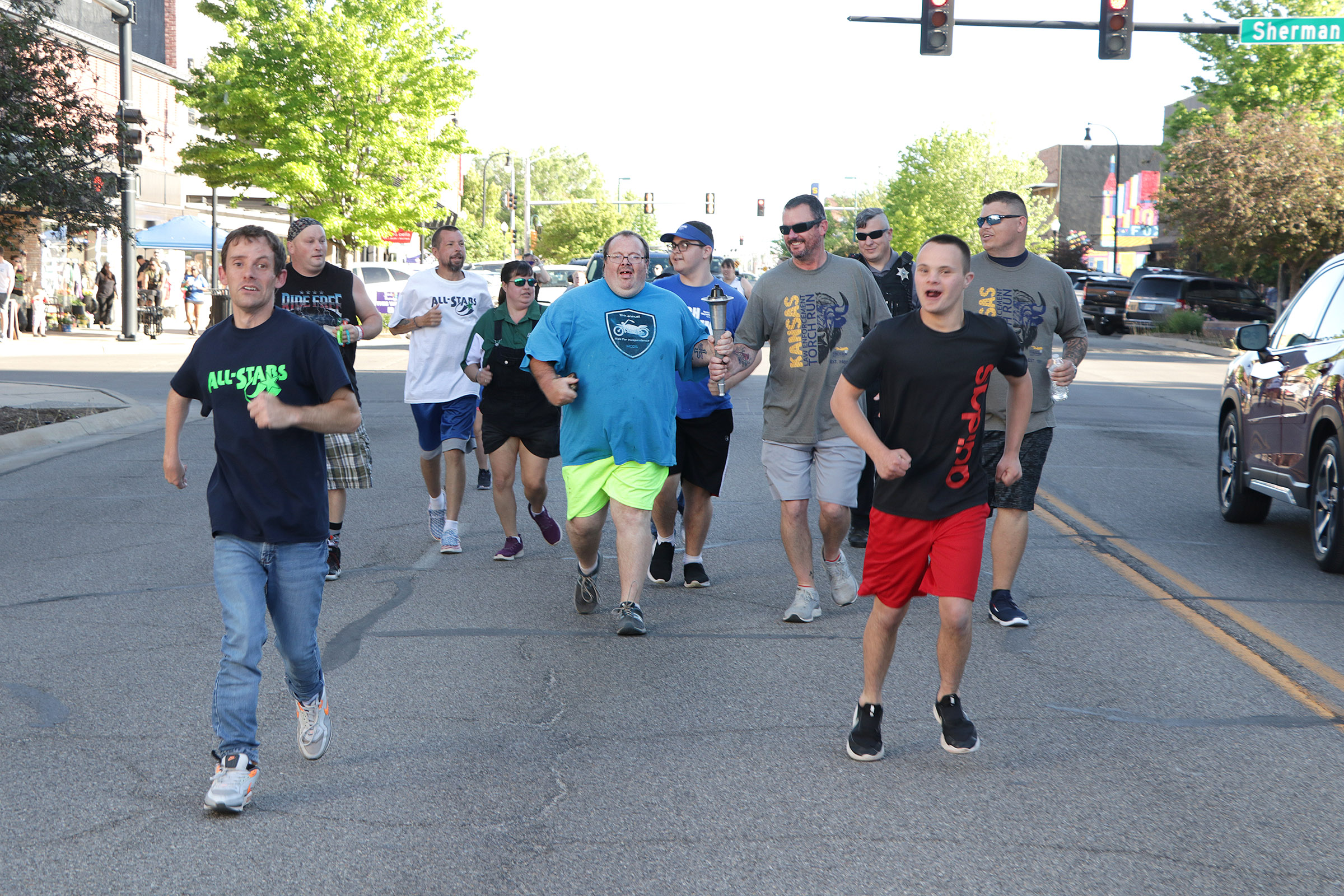 2025 Torch Run runner blue yellow.jpg