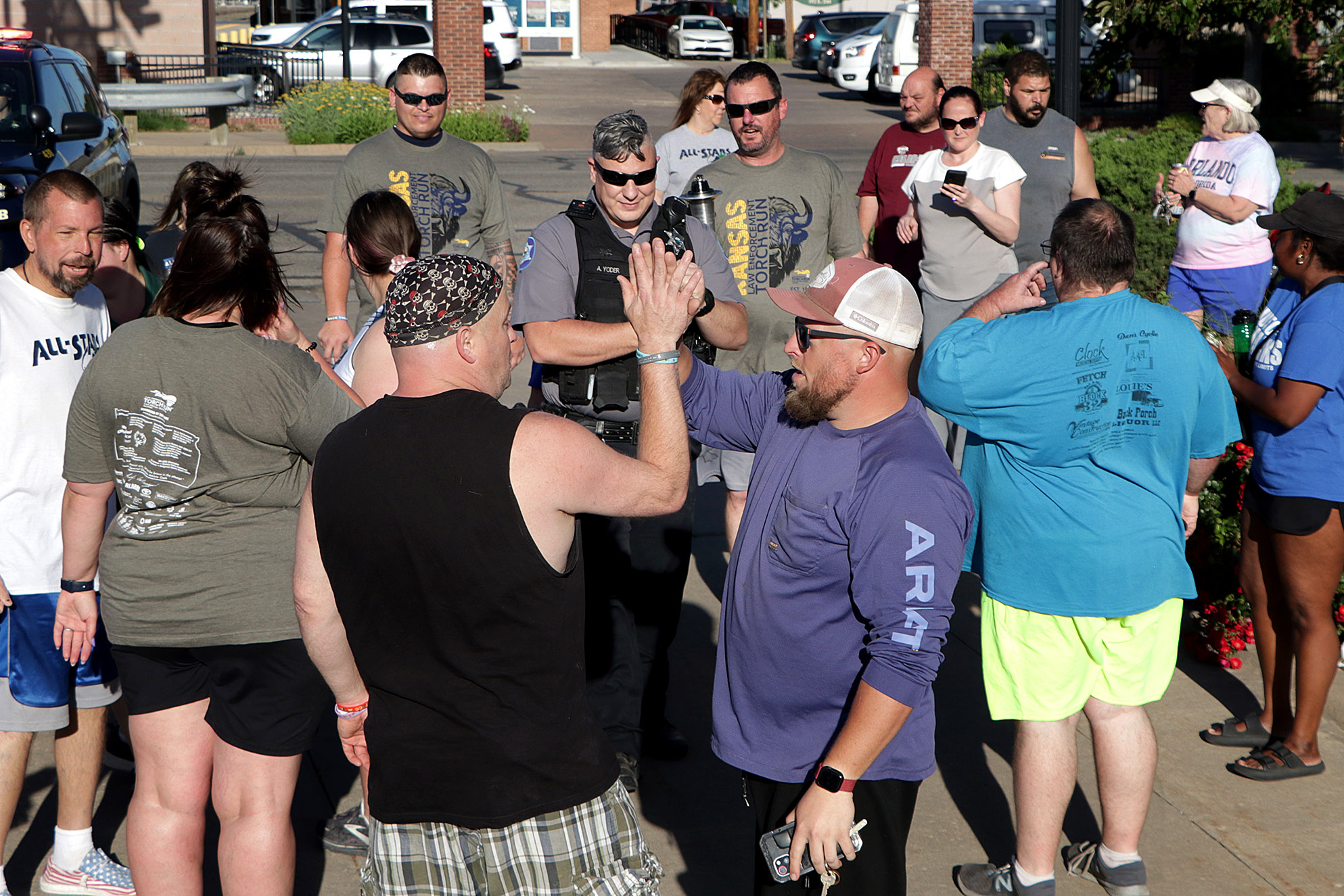 2025 Torch Run end high five 01.jpg
