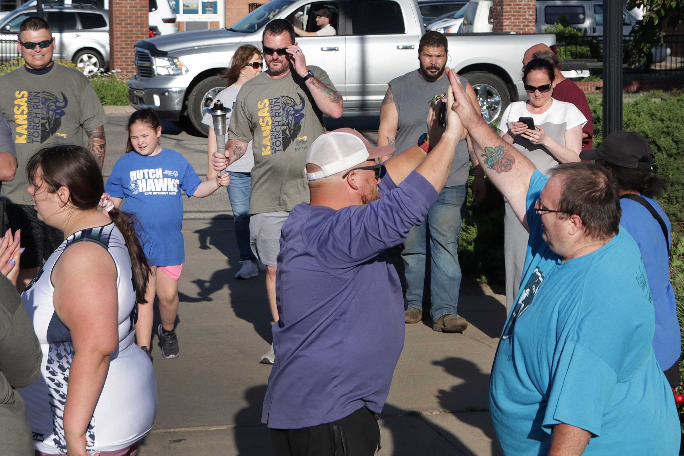 2025 Torch Run end high five 02.jpg