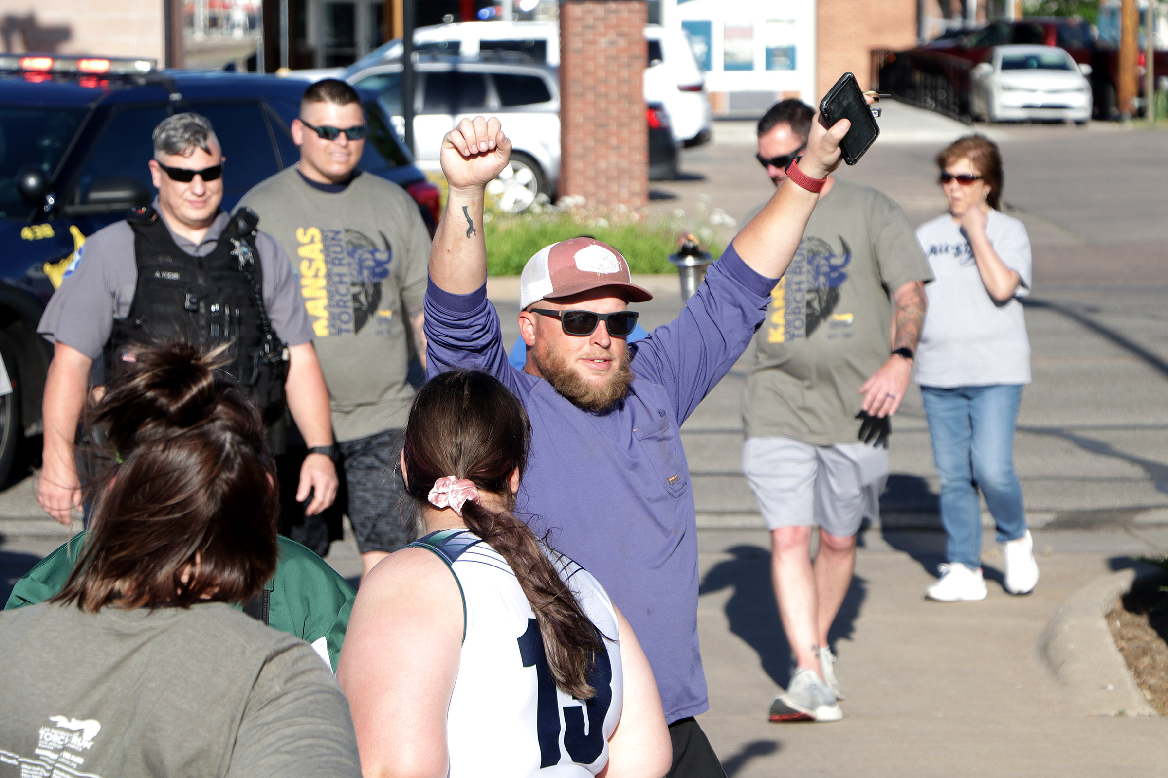 2025 Torch Run end high five 03.jpg